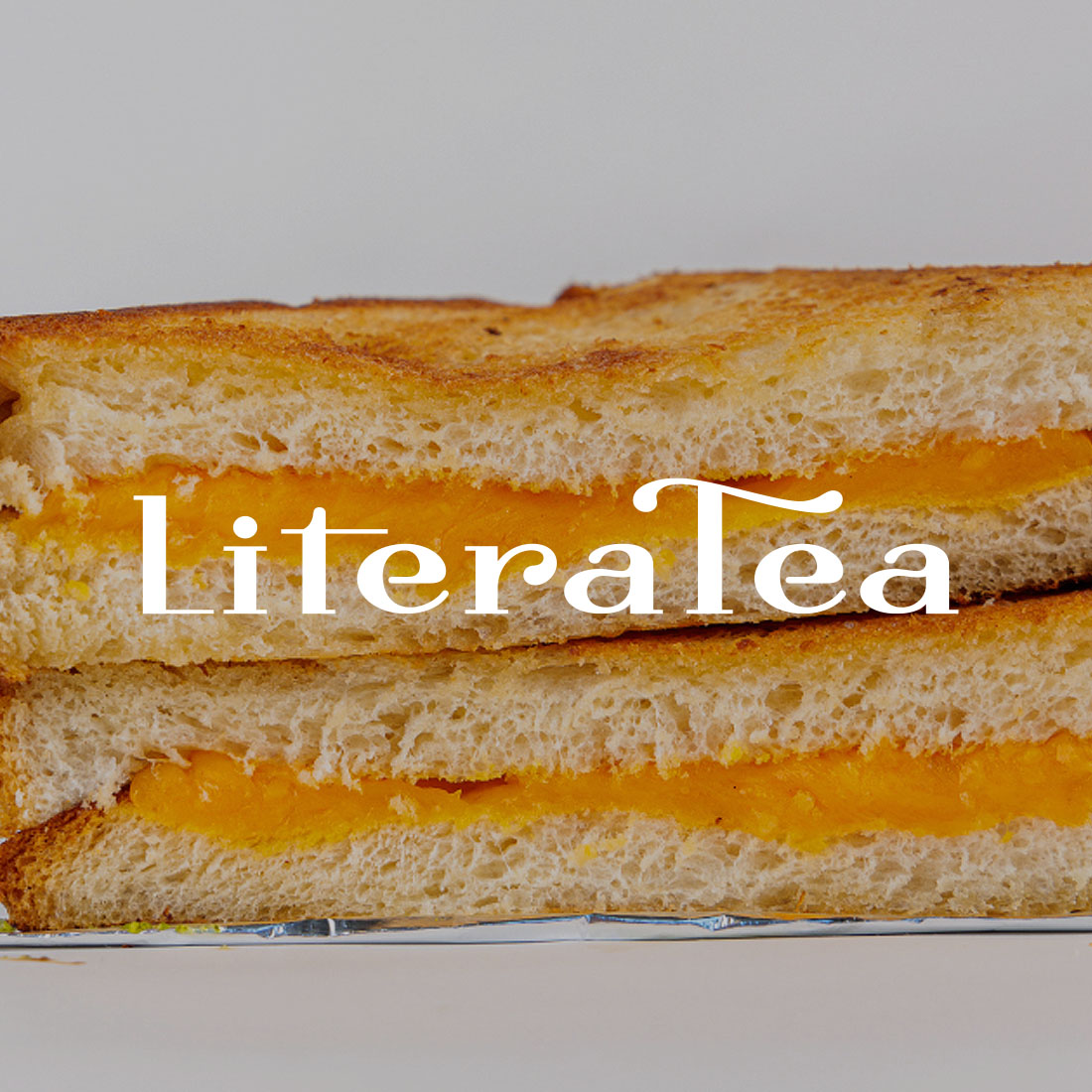 Literatea logo over grilled cheese sandwich